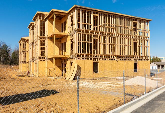 a temporary chain link fence locking away a building under renovation, serving as a security tool in Leesburg, IN